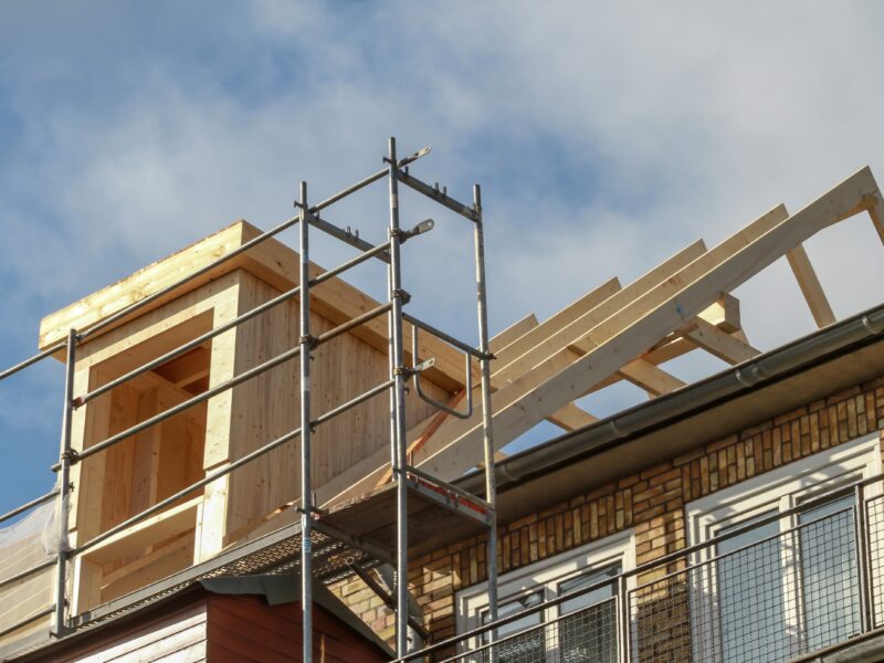 Dormer,Installation,On,The,Rooftop,Of,A,Apartment,House